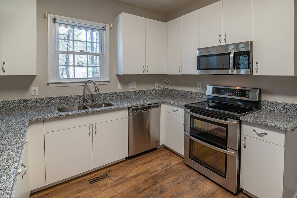 white-wooden-kitchen-cabinet-near-white-wooden-framed-glass-3958951